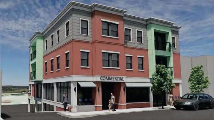 Three-storey building with commercial space at street level
