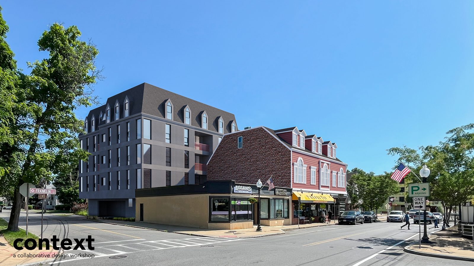 Historic mansard-roofed building on a corner with a new connected structure beside it