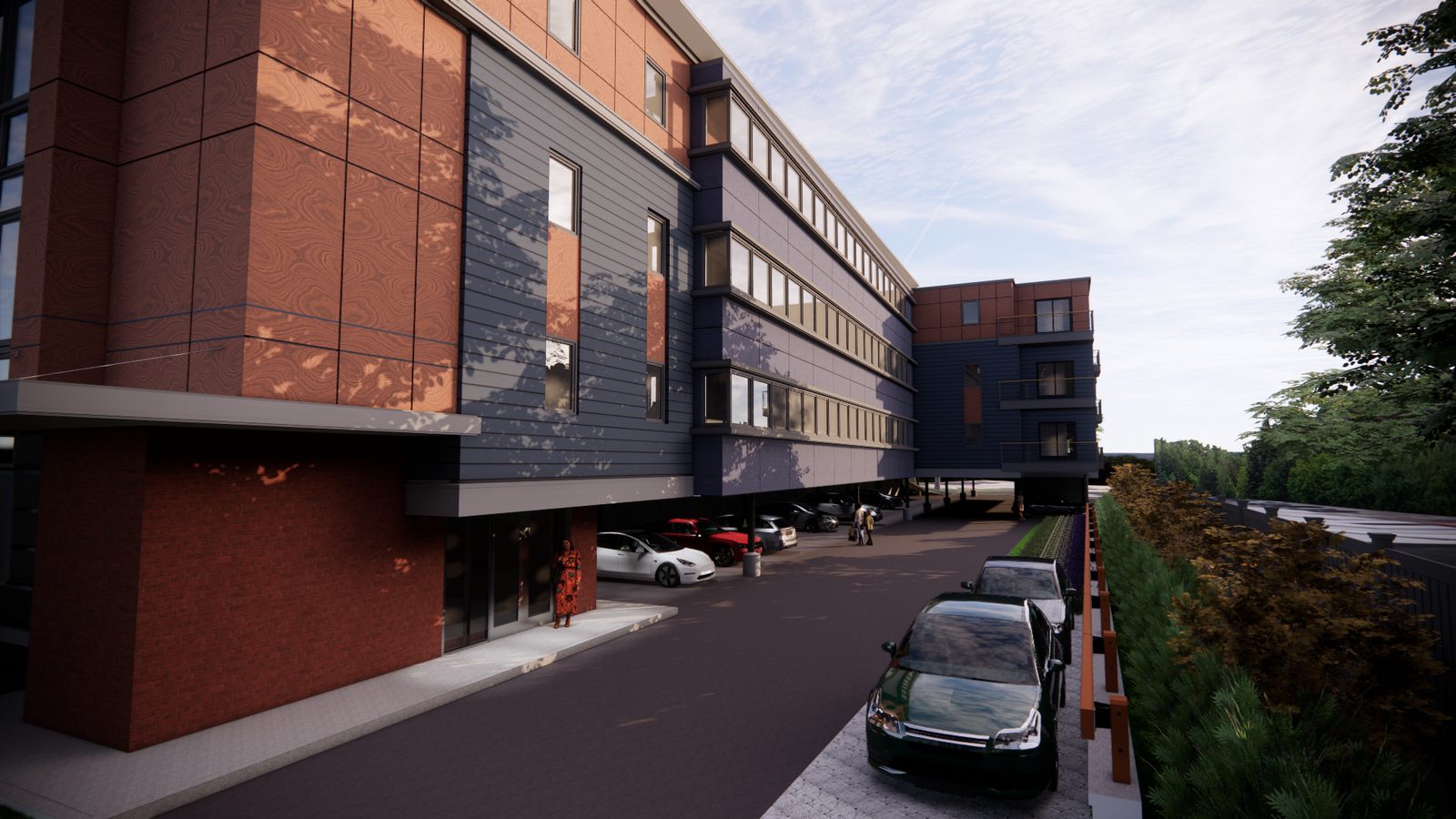 Four-storey building with a brick and panelled facade seen from the street